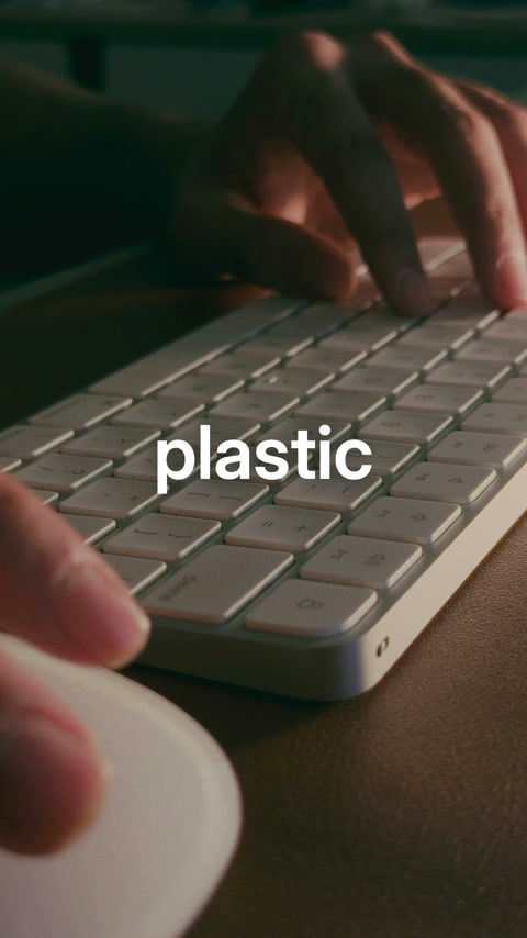 Working board frame: hands on a real keyboard accompany the word plastic